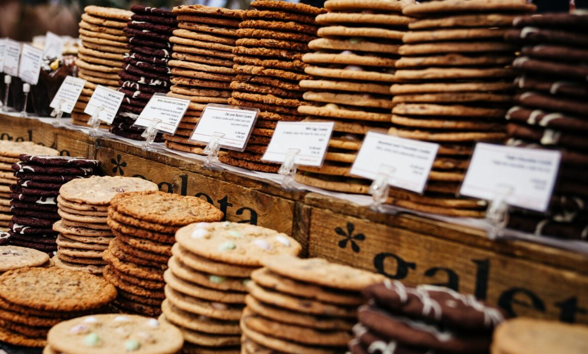 Stacks of fresh cookies on a bakery counter