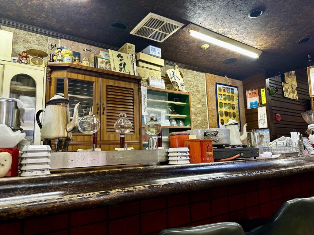 Worn wooden counter of a small cafe