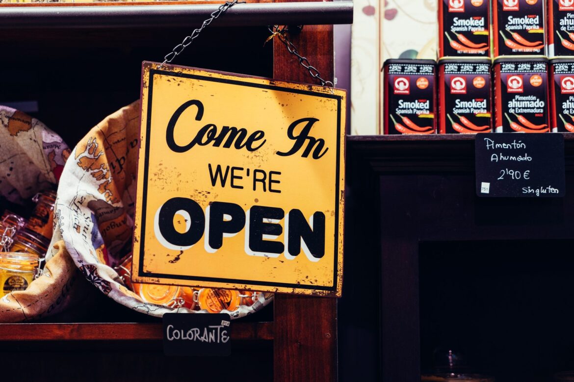 Come in, we're open sign hanging in a shop